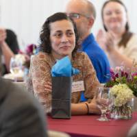 faculty sitting at tables